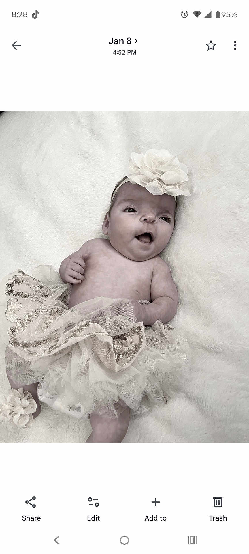 Jayla joined the competition — help win amazing prizes! baby, infant, tutu, headband, flower, smiling, cute, lying_down, blanket, soft_texture, adorable, child, happy, portrait, newborn, clothing, tulle, sparkle, face, skin