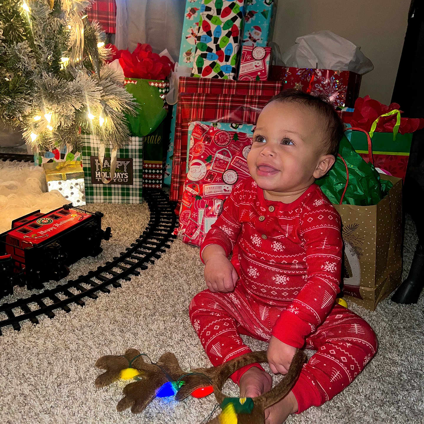 Reece is registered to the contest to win money with this photo: accessories, architecture, baby, bag, building, couch, face, furniture, handbag, head, indoors, livingroom, person, photography, plant, portrait, pottedplant, railway, room, train