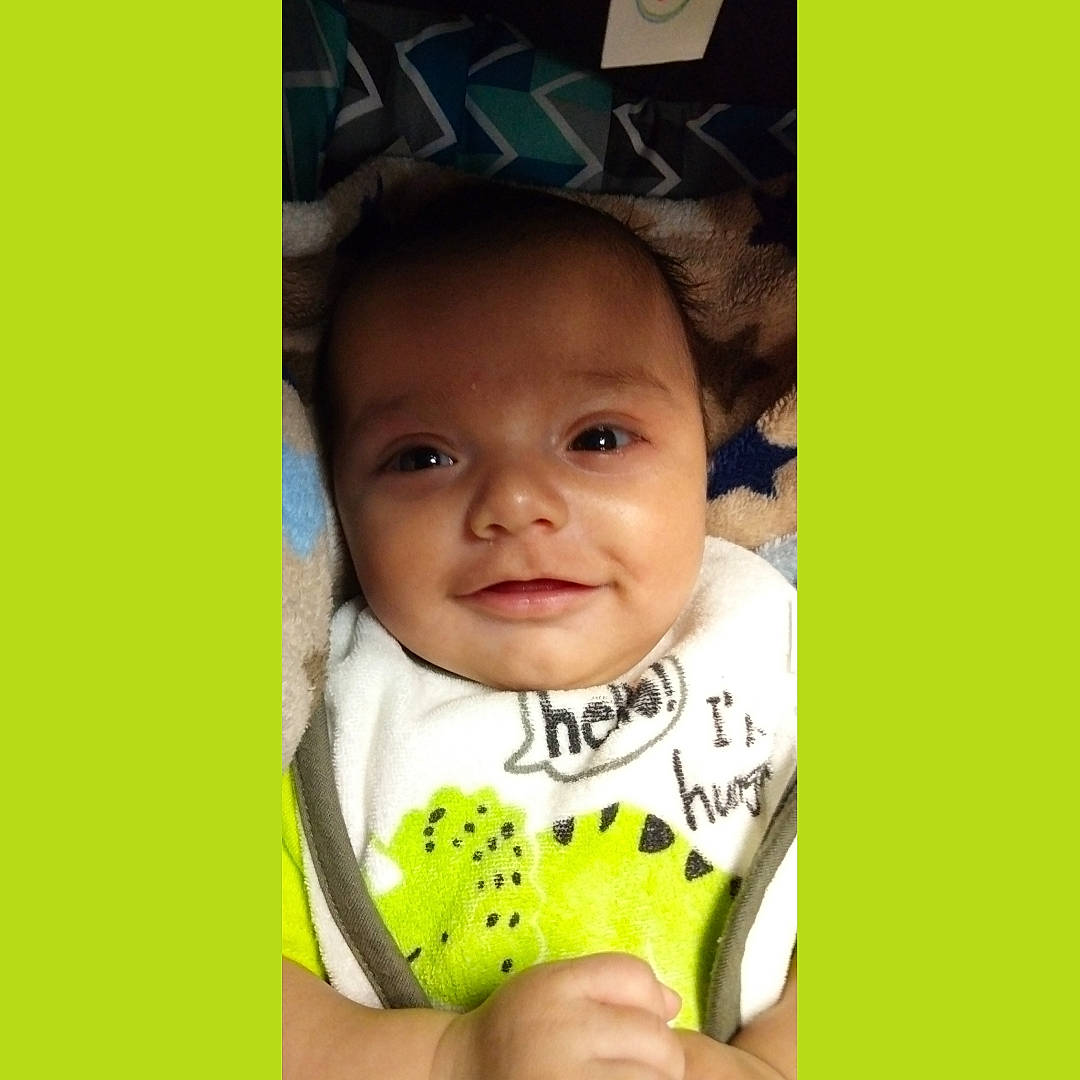 Adan is registered to the contest to win money with this photo: baby, baby_toddler_clothing, cheek, chin, eyebrow, face, facial_expression, hairstyle, happy, head, iris, mammal, mouth, neck, nose, outerwear, person, shirt, sleeve, smile