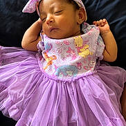 Kathaleya joined the competition — help win amazing prizes! baby, sleeping, tutu, headband, bow, purple, dress, infant, cartoon_characters, cute, peaceful, clothing, lying_down, child, adorable, soft_fabric, resting, person, portrait, closeup