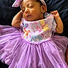 baby, sleeping, tutu, headband, bow, purple, dress, infant, cartoon_characters, cute, peaceful, clothing, lying_down, child, adorable, soft_fabric, resting, person, portrait, closeup