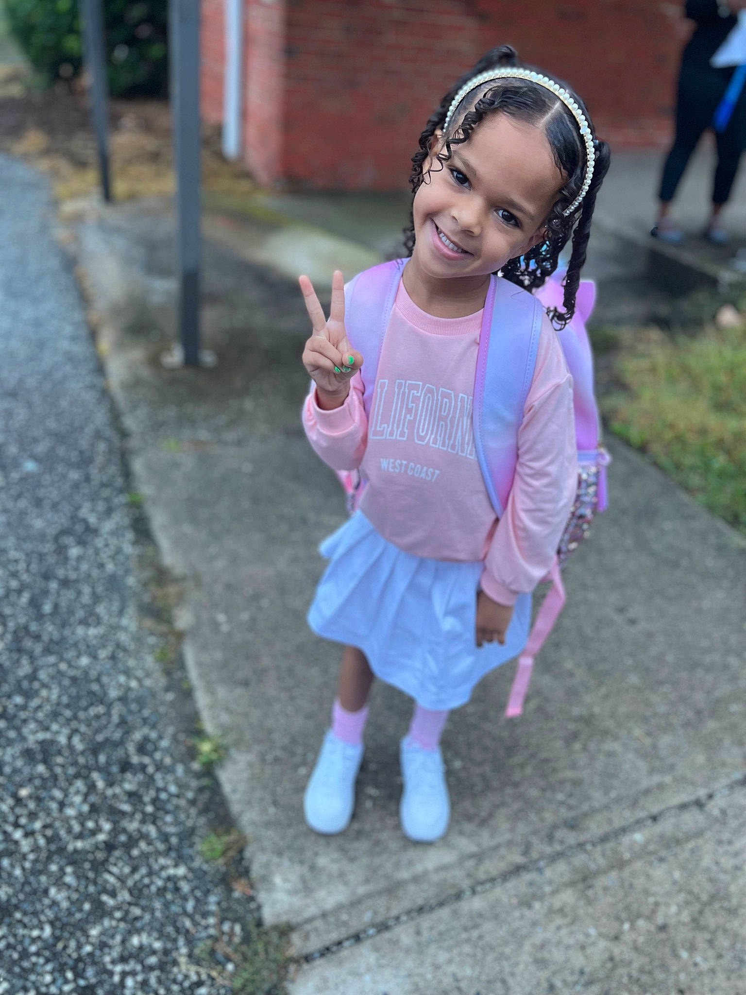 Selah is registered to the contest to win money with this photo: asphalt, city, face, fun, grass, happy, head, joy, leaf, leisure, magenta, morning, person, pink, plant, play, public_space, recreation, road, road_surface