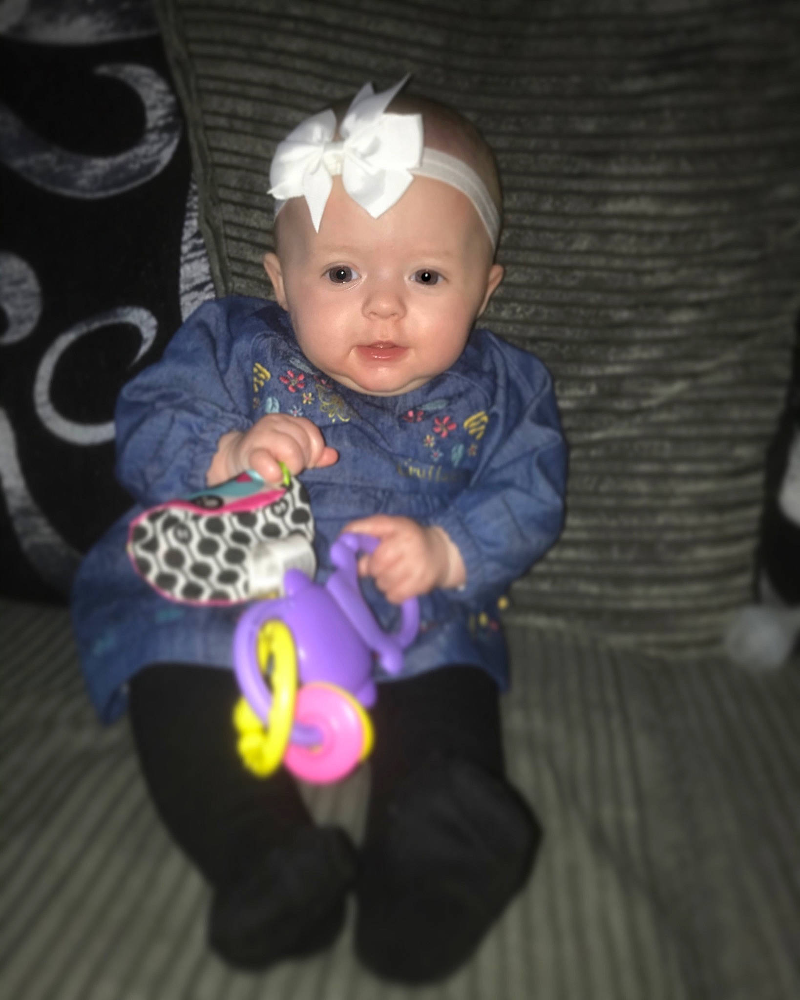 Isobel is registered to the contest to win money with this photo: baby, baby_products, baby_toys, cheek, child, ear, eye, fun, head, iris, person, play, product, purple, sitting, skin, toddler, toy