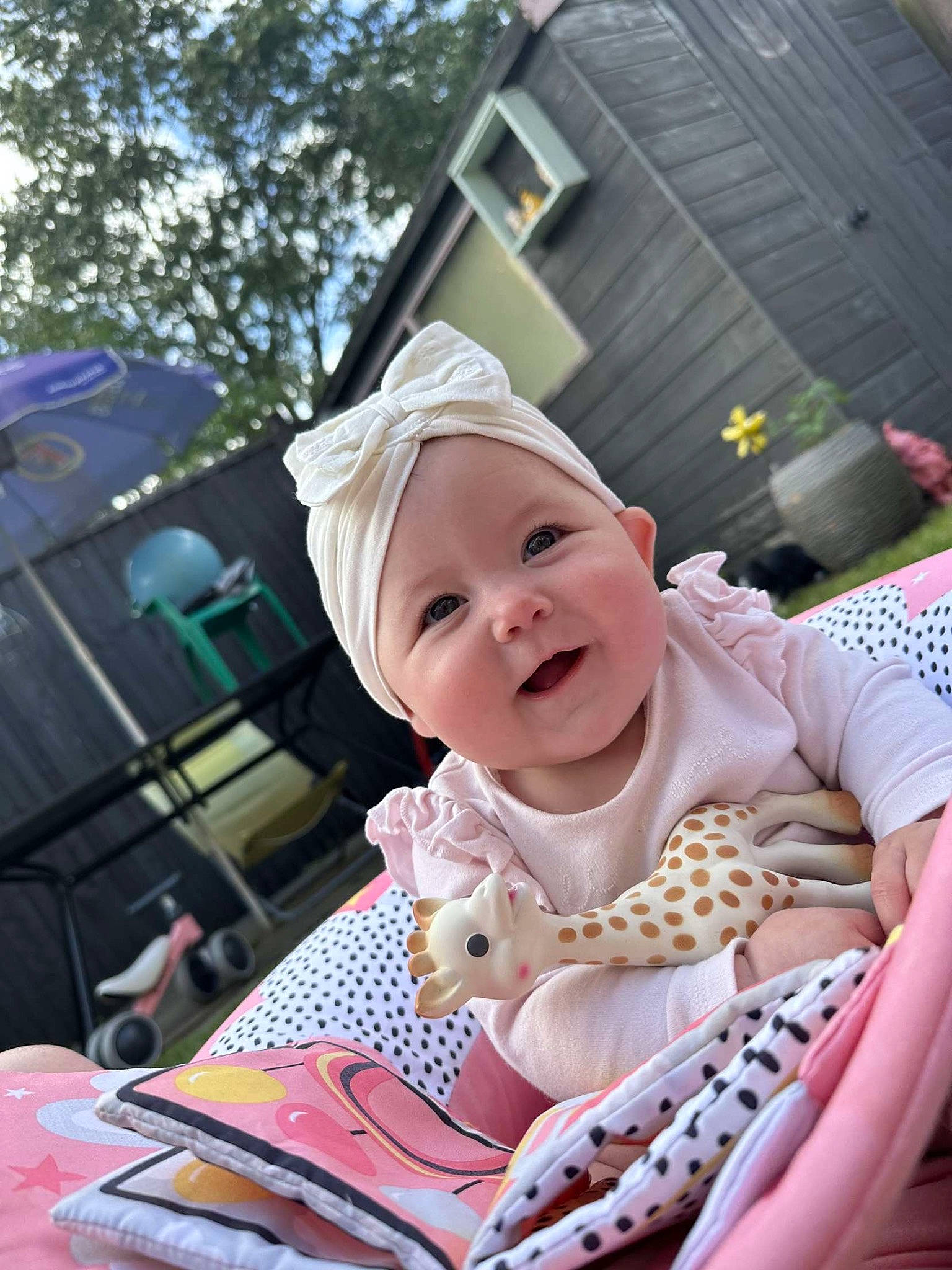 Esmae joined the competition — help win amazing prizes! baby, baby_toddler_clothing, baseball_cap, child, event, fashion_accessory, fun, grass, happy, hat, joy, laugh, leisure, magenta, person, pink, recreation, sitting, smile, sun_hat