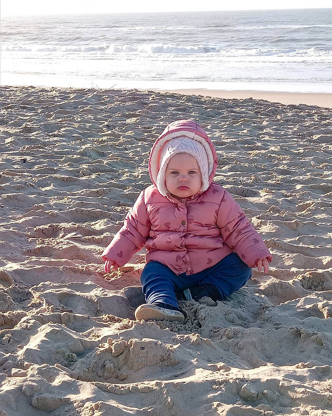 Sohalia participe au concours pour gagner de l'argent avec cette photo : baby, baby_toddler_clothing, beach, child, coast, fun, headwear, horizon, landscape, ocean, people_in_nature, person, recreation, sand, shore, sitting, sky, soil, toddler, water