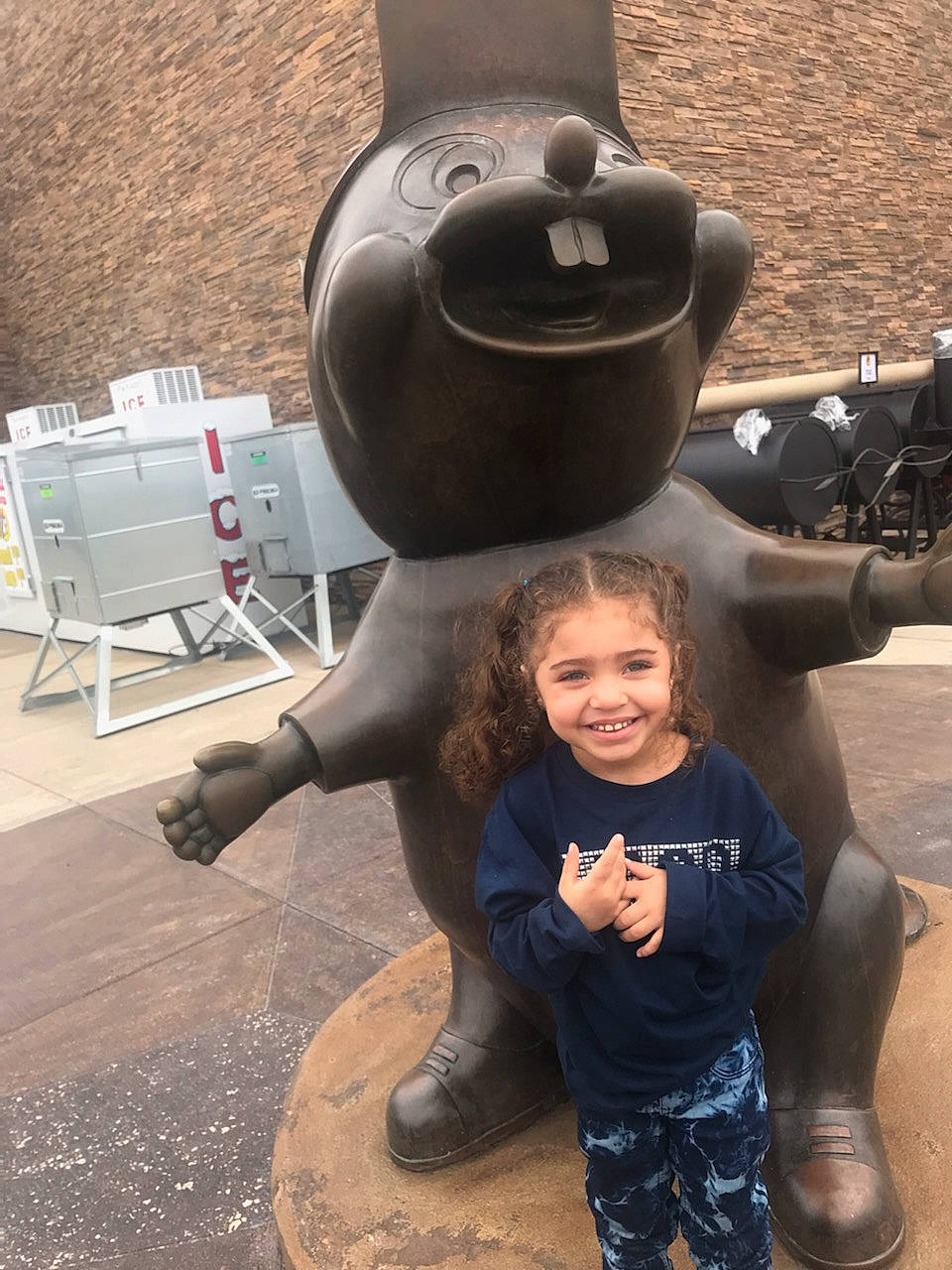 Charlee is registered to the contest to win money with this photo: art, bronze_sculpture, chair, fun, gesture, happy, joy, leisure, metal, monument, person, plant, recreation, sculpture, smile, snout, statue, toddler, tourism, tourist_attraction