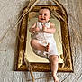 Sacha participe au concours pour gagner de l'argent avec cette photo : baby, child, cute, decor, dried_grass, foot, golden_frame, hand, happy, indoor, light, mirror, overalls, playful, portrait, reflection, rug, smiling, texture, young