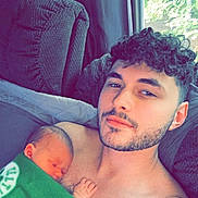 Kinzley joined the competition — help win amazing prizes! adult, baby, blanket, clothing, cushion, face, furniture, head, homedecor, indoors, male, man, newborn, person, photography, portrait, skin, sleeping, t_shirt, tattoo