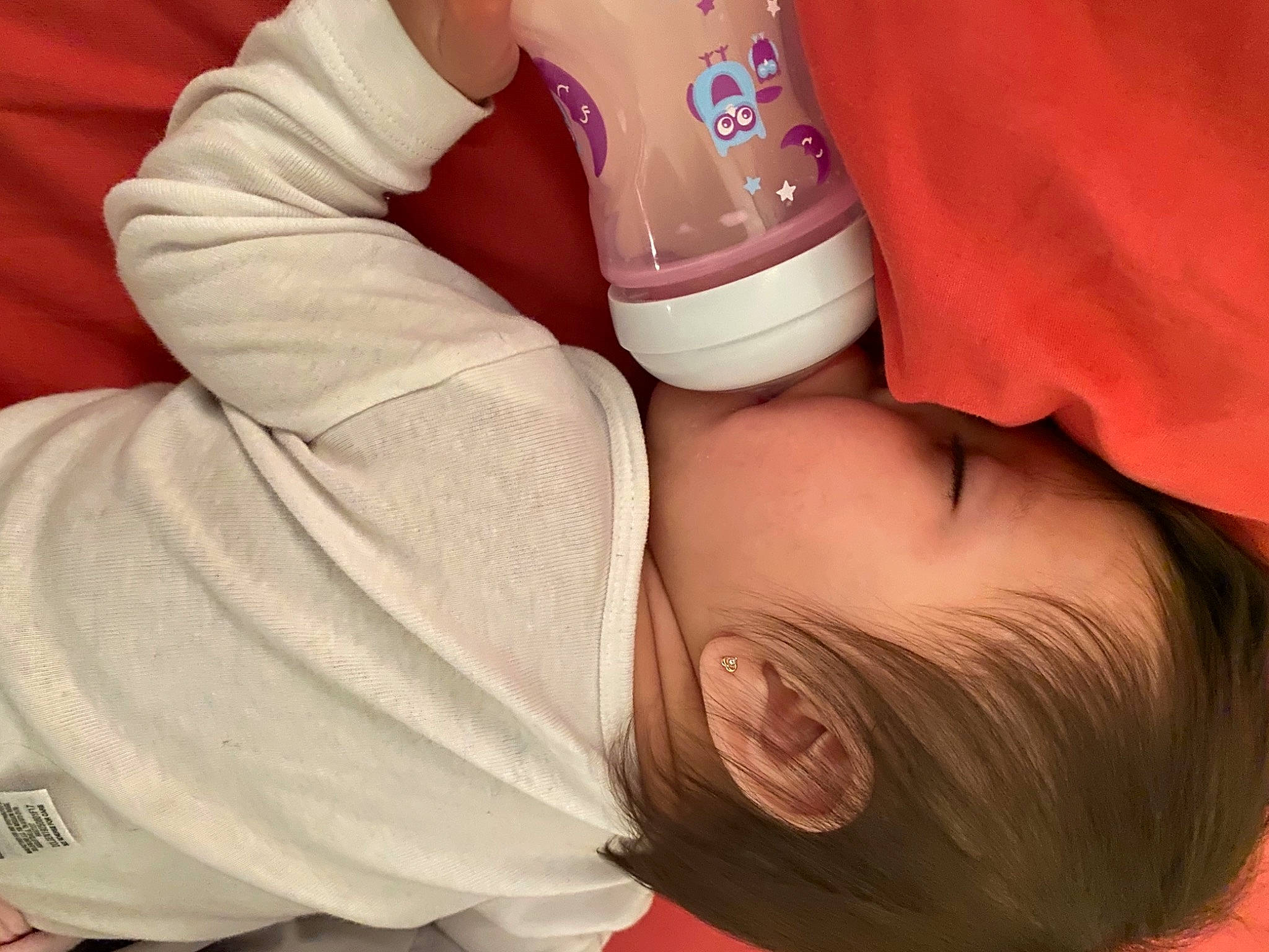 Amy joined the competition — help win amazing prizes! arm, baby, baby_toddler_clothing, cheek, comfort, drinkware, eyelash, facial_expression, finger, gesture, hand, helmet, human_body, mammal, mouth, nail, neck, nose, person, skin