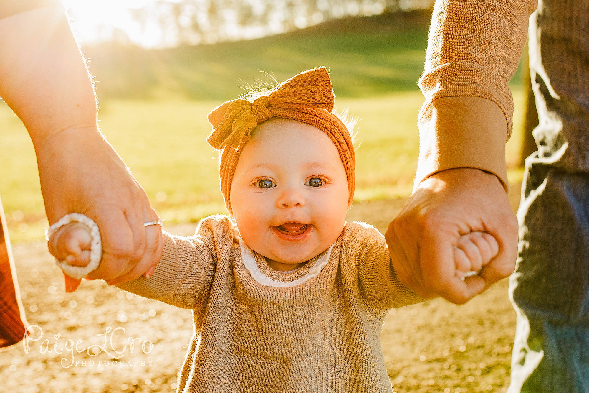 Ellie joined the competition — help win amazing prizes! arm, baby, face, facial_expression, finger, fun, gesture, grass, hand, happy, head, interaction, leisure, people_in_nature, person, skin, smile, summer, thumb, toddler