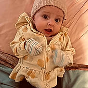 Rosalina joined the competition — help win amazing prizes! baby, child, infant, hat, knitted_hat, jacket, zipper, mittens, bed, blanket, pillow, soft_fabric, cute, wide_eyes, expression, indoor, person, clothing, portrait, lying_down