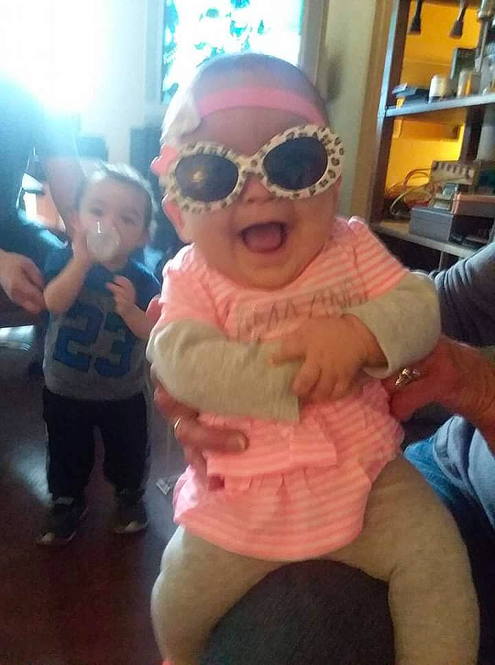 Ellie is registered to the contest to win money with this photo: baby, child, cool, eyewear, fun, glasses, headwear, person, pink, selfie, smile, sunglasses, toddler, vision_care