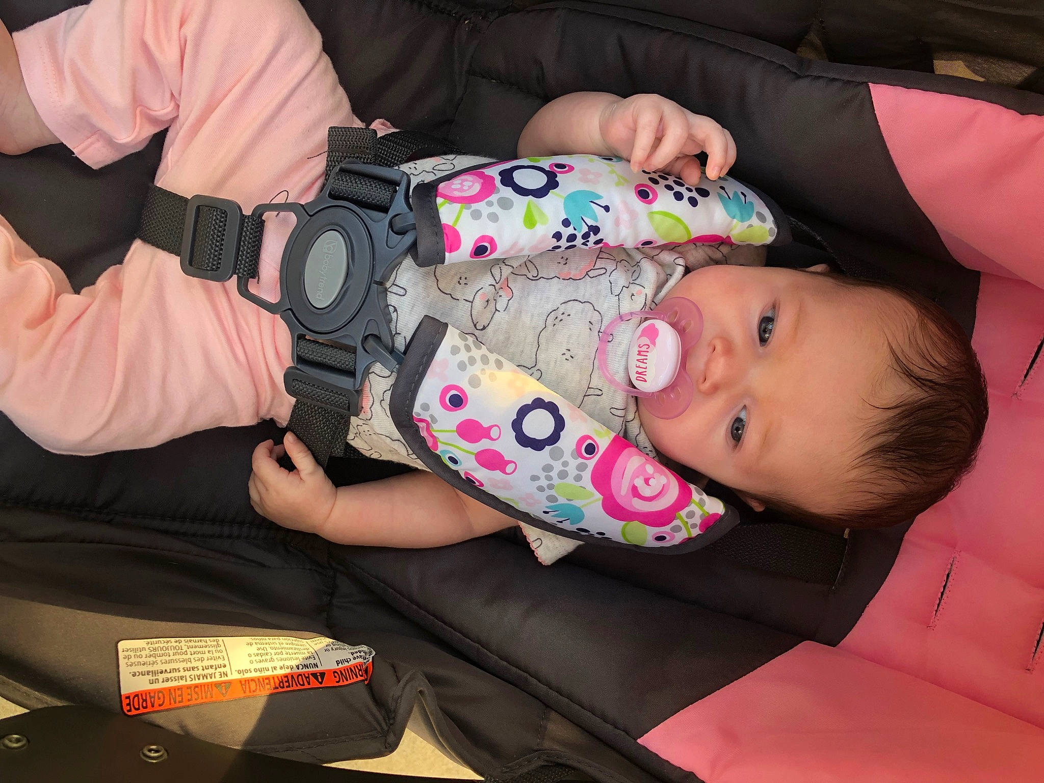 Kenzlee is registered to the contest to win money with this photo: baby, baby_carriage, baby_products, baby_toddler_clothing, cheek, child, comfort, eye, finger, fun, human_body, iris, mouth, nail, pattern, person, pink, sitting, skin, sleeve