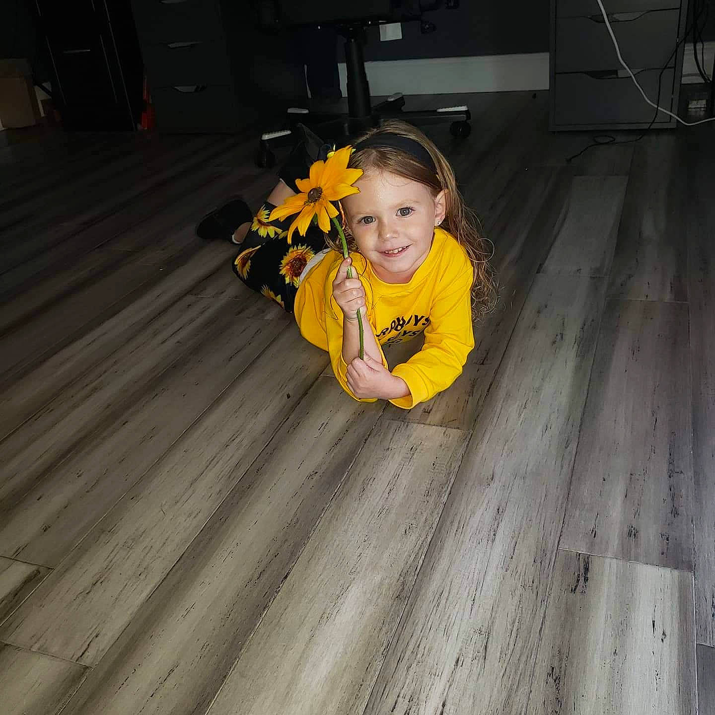 Mariangela is registered to the contest to win money with this photo: child, floor, flooring, fun, hardwood, joy, laminate_flooring, leg, person, photograph, photography, room, sitting, smile, snapshot, standing, toddler, varnish, wood, wood_flooring