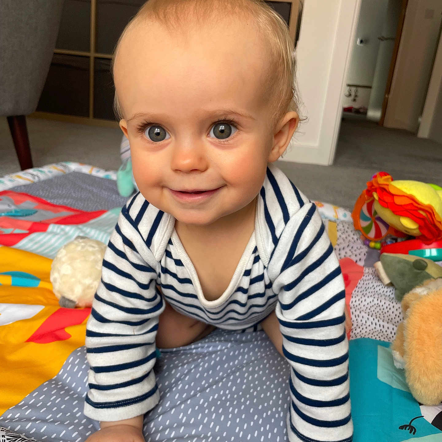 Imogen joined the competition — help win amazing prizes! baby, babycrawling, chair, crawling, cushion, face, furniture, head, homedecor, person, photography, portrait, toy