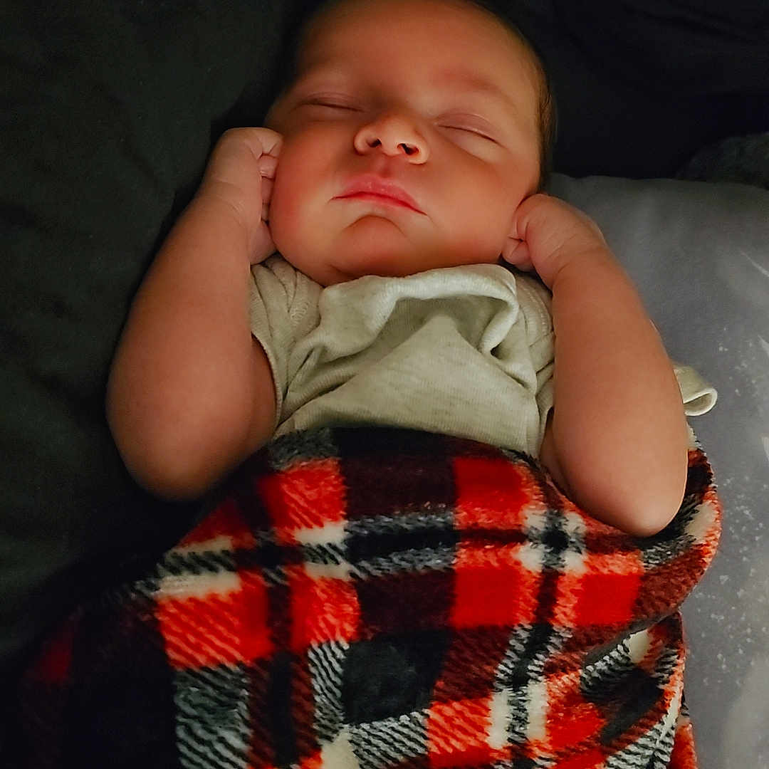 Saviour joined the competition — help win amazing prizes! baby, black, blanket, child, comfort, cozy, cute, hands, indoors, infant, peaceful, plaid, portrait, red, resting, sleeping, soft, toddler, warm, white