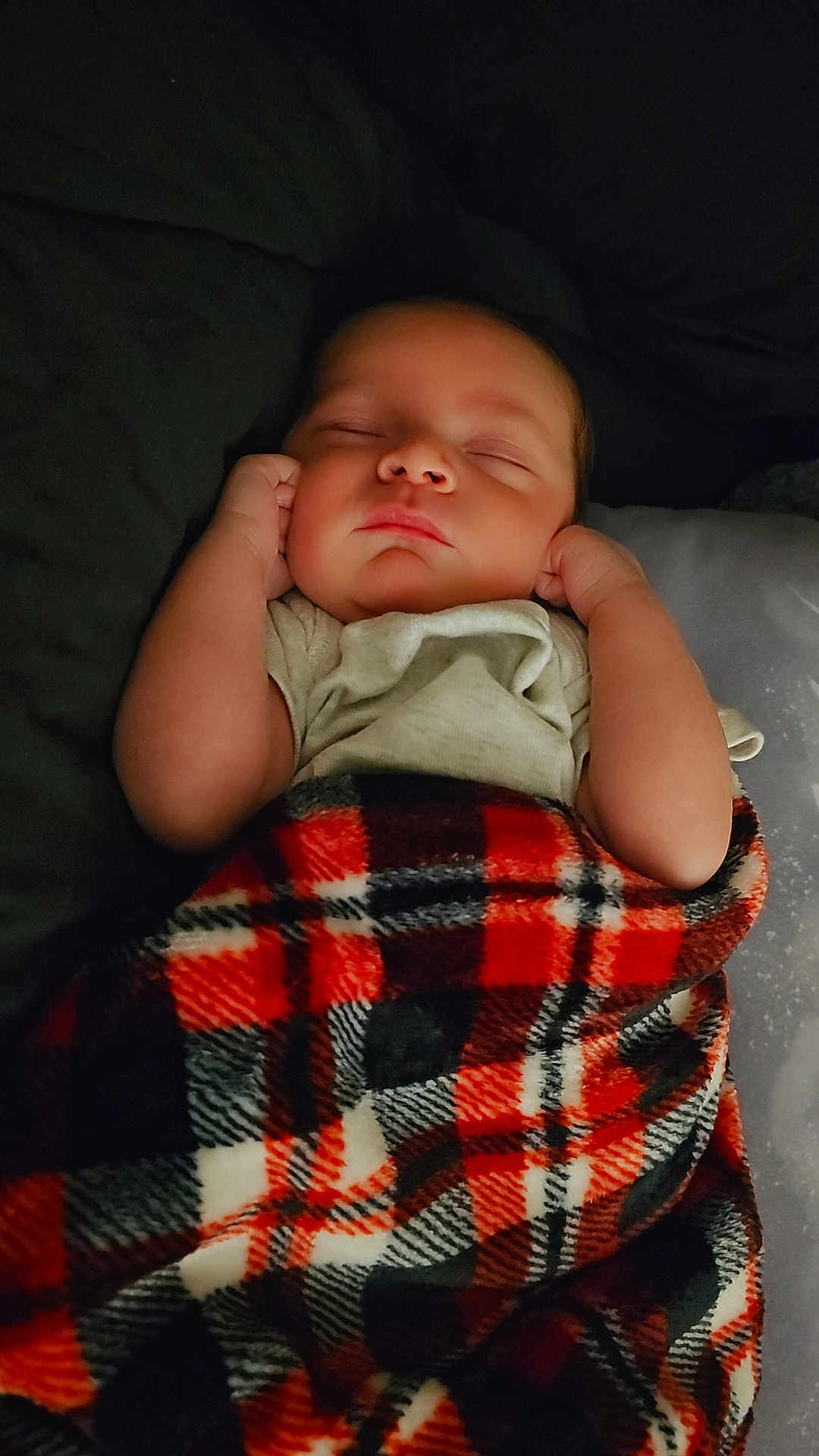 Saviour joined the competition — help win amazing prizes! baby, sleeping, blanket, plaid, red, black, white, infant, cozy, hands, peaceful, resting, cute, child, soft, portrait, indoors, warm, comfort, toddler