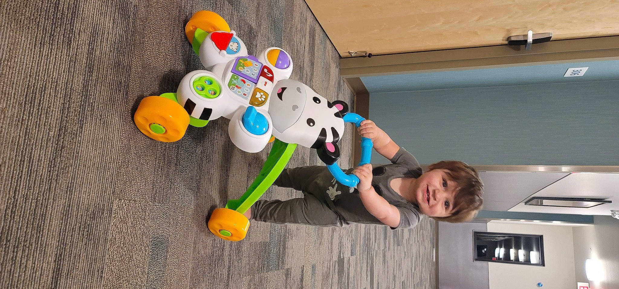 Caspian joined the competition — help win amazing prizes! animation, art, baby_toys, child, font, fun, happy, joy, leisure, person, plastic, play, recreation, room, shorts, smile, stuffed_toy, t_shirt, toddler, toy