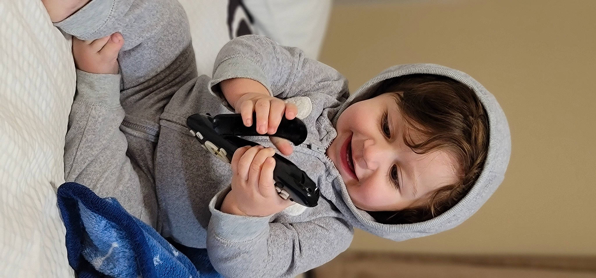 Caspian is registered to the contest to win money with this photo: camera, cameras_optics, child, comfort, eyelash, eyewear, fun, gesture, hand, happy, hat, nail, person, photographer, plant, single_lens_reflex_camera, sitting, skin, smile, toddler