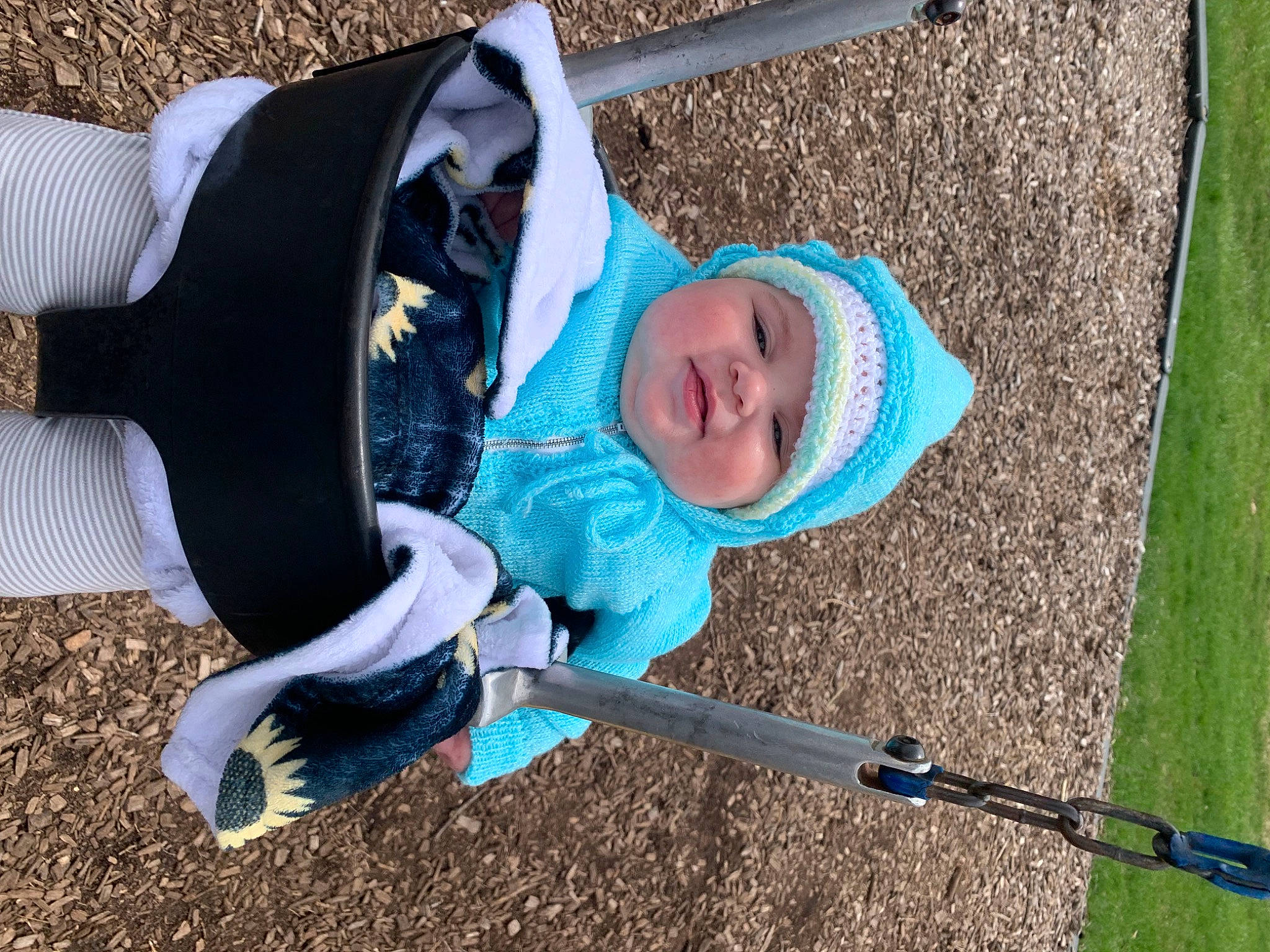 Wynter joined the competition — help win amazing prizes! baby, baby_products, baby_toddler_clothing, child, city, electric_blue, eye, face, fun, grass, hat, headwear, jacket, leisure, outdoor_play_equipment, person, play, playground, recreation, smile