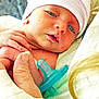 newborn, baby, infant, hand, pacifier, hat, skin, face, closeup, hospital, person, cute, tender, holding, soft, newborn_clothing, resting, baby_face, portrait, young
