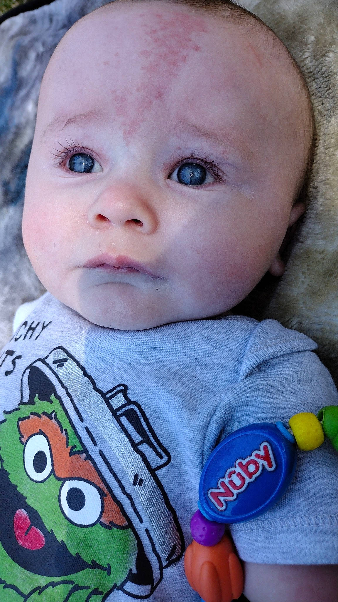 Ej is registered to the contest to win money with this photo: baby, baby_toddler_clothing, blue, cheek, chin, clothing, eyelash, face, head, human_body, iris, lip, mouth, nose, organ, person, pink, product, skin, sleeve