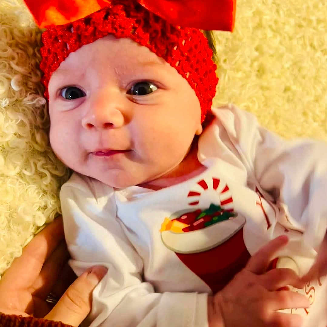 Hazel joined the competition — help win amazing prizes! accessories, baby, bodypart, bonnet, cap, clothing, coat, face, festival, finger, hand, happy, hat, head, jacket, newborn, person, photography, portrait, smile