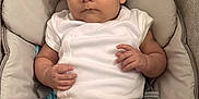 Zayn joined the competition — help win amazing prizes! baby, infant, child, onesie, seat, baby_carrier, cushion, face, expression, curious, neutral_colors, skin, hand, foot, indoor, young_child, person, portrait, clothing, comfort