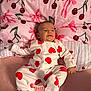 Zayn joined the competition — help win amazing prizes! baby, infant, onesie, hearts, pink, bed, pillow, cherry_pattern, sleepwear, smiling, child, cute, lying_down, cozy, fabric, bedroom, soft, comfort, happy, face