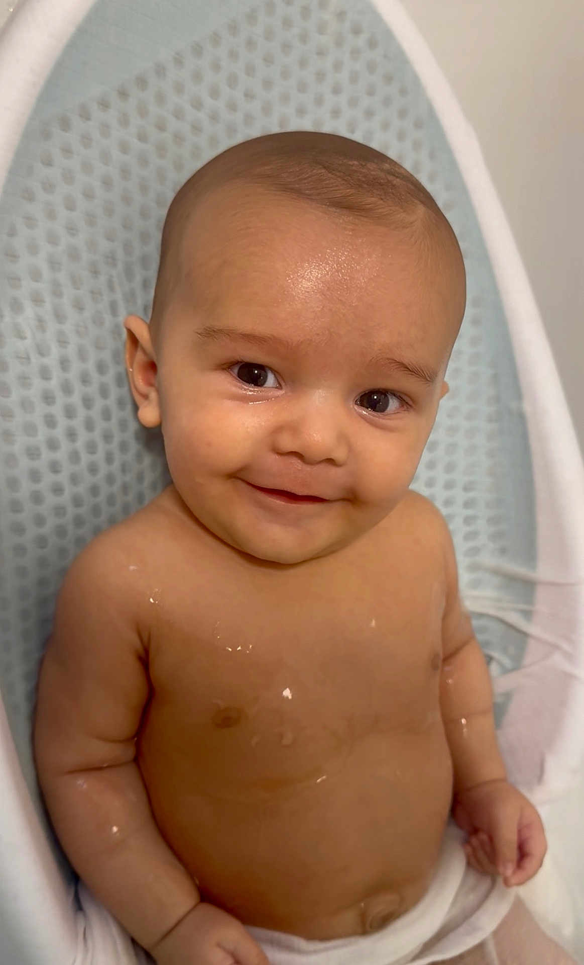 Zayn joined the competition — help win amazing prizes! baby, smiling, infant, face, skin, water_droplets, seat, comfort, child, cute, happy, indoors, head, arms, torso, chest, expression, young_child, portrait, baby_bath