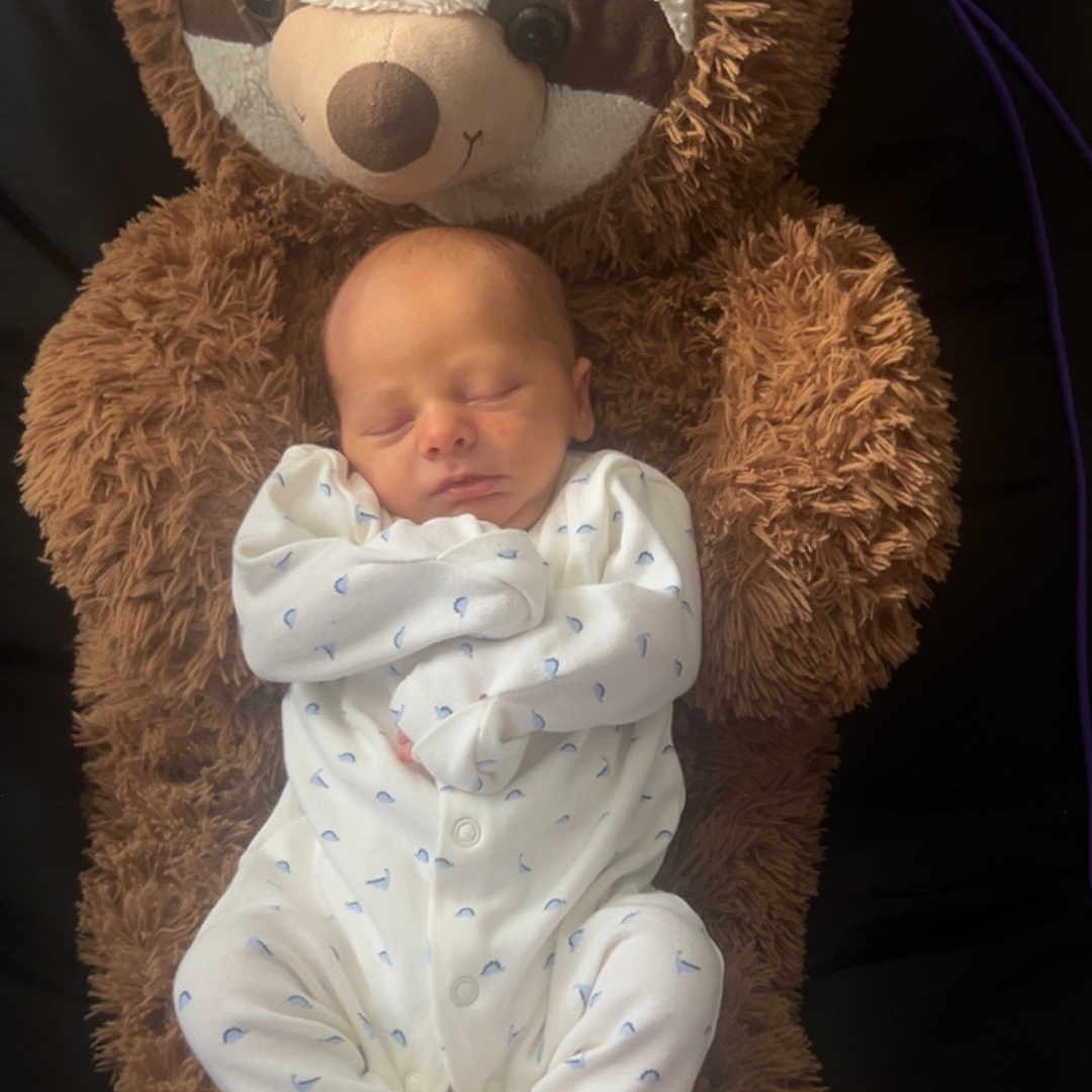 Noah joined the competition — help win amazing prizes! adorable, baby, bedtime, child, comfort, cozy, cuddly, cute, infant, newborn, onesie, plush_toy, resting, sleep, sleeping, sloth, soft, stuffed_animal, toddler, white_clothing