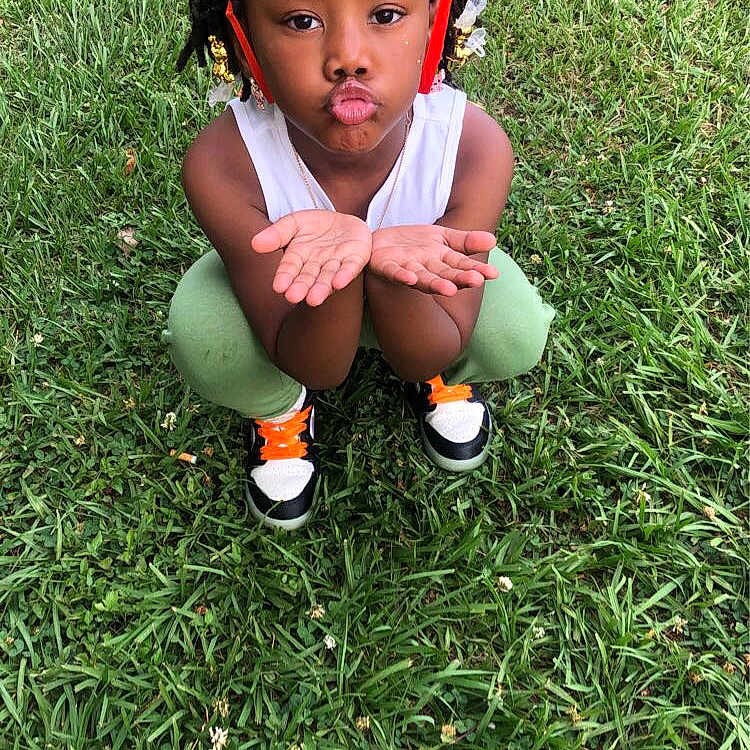 Baltimore joined the competition — help win amazing prizes! backyard, ball, child, face, female, football, girl, grass, head, lawn, nature, outdoors, park, person, photography, plant, portrait, soccer, soccerball, sport