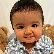 Dariel joined the competition — help win amazing prizes! baby, child, face, smile, striped_shirt, buttoned_shirt, teddy_bear, plush_toy, cute, portrait, indoors, person, young_child, happy, closeup, cheeks, button, brown_hair, playful, soft_toys