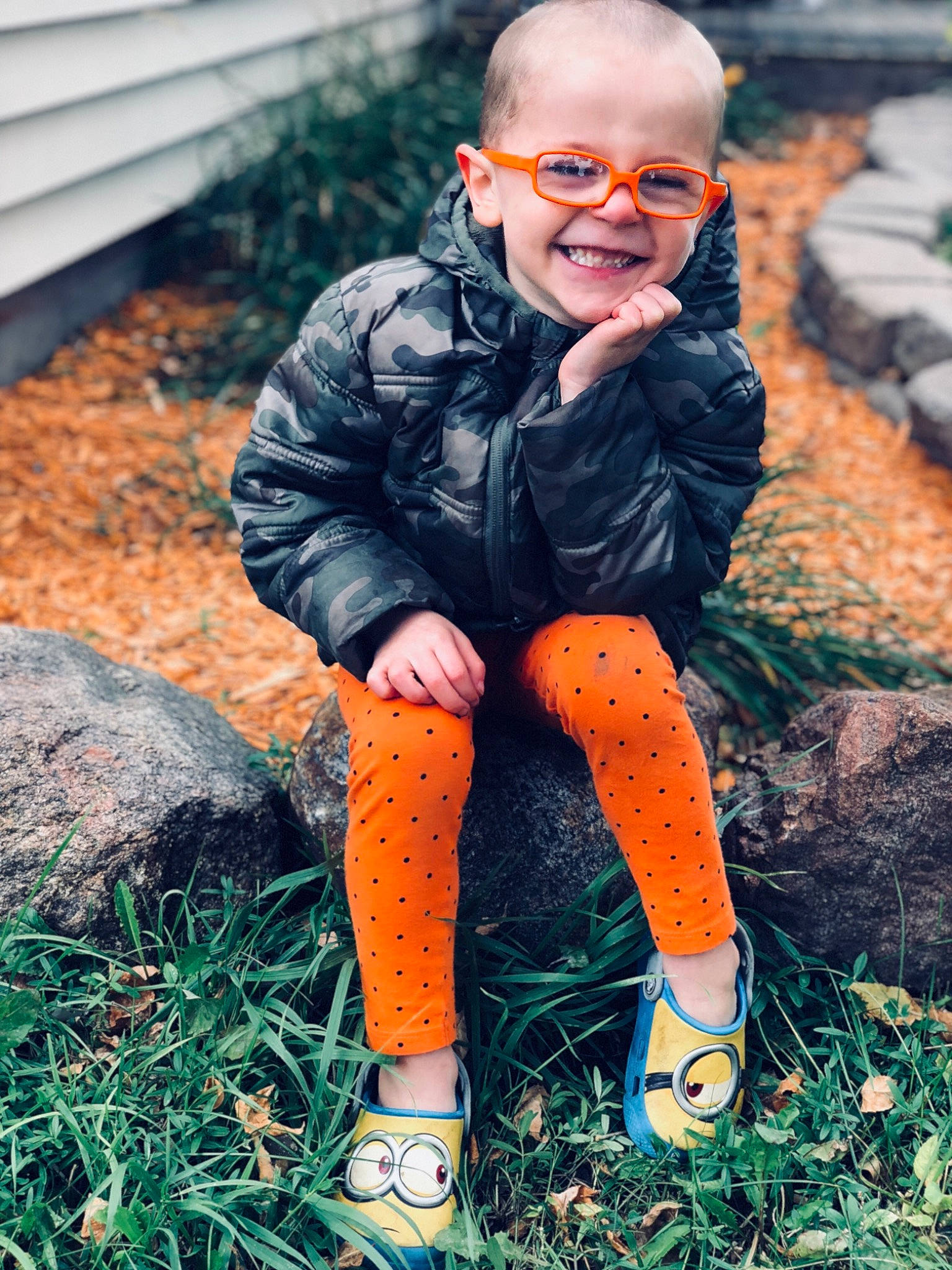 Noah joined the competition — help win amazing prizes! cool, eyewear, footwear, glasses, grass, jacket, joy, male, orange, outerwear, people, person, photo_shoot, photograph, photography, portrait_photography, rock, shoe, sitting, smile
