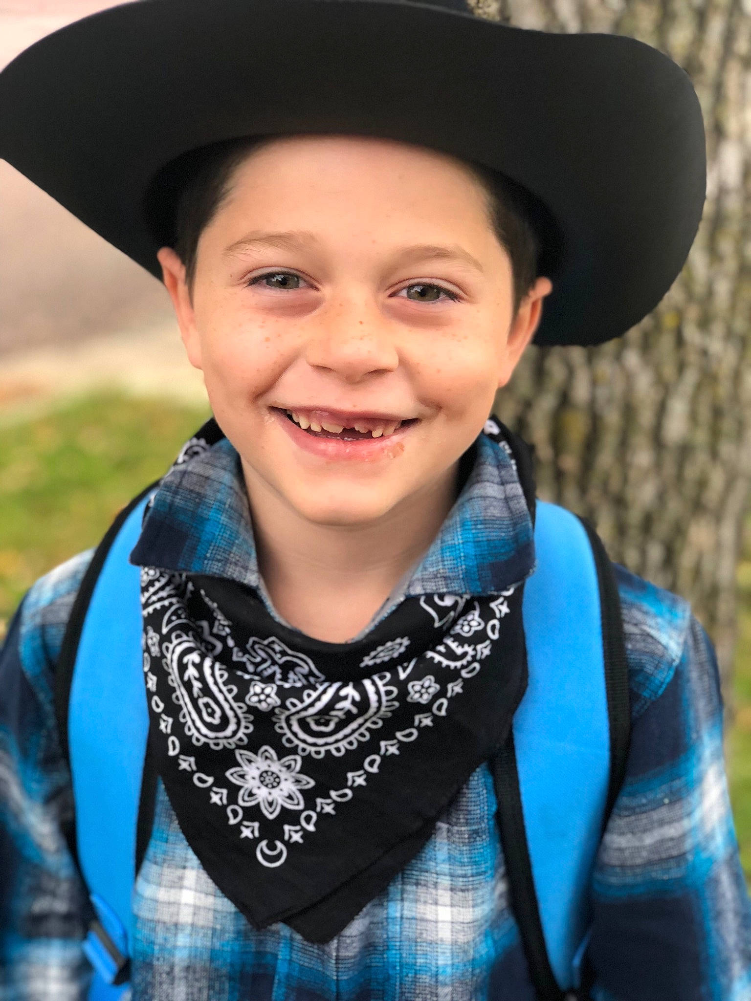 Isaiah joined the competition — help win amazing prizes! clothing, design, fashion_accessory, hat, headgear, joy, neck, pattern, person, scarf, smile, tartan, textile