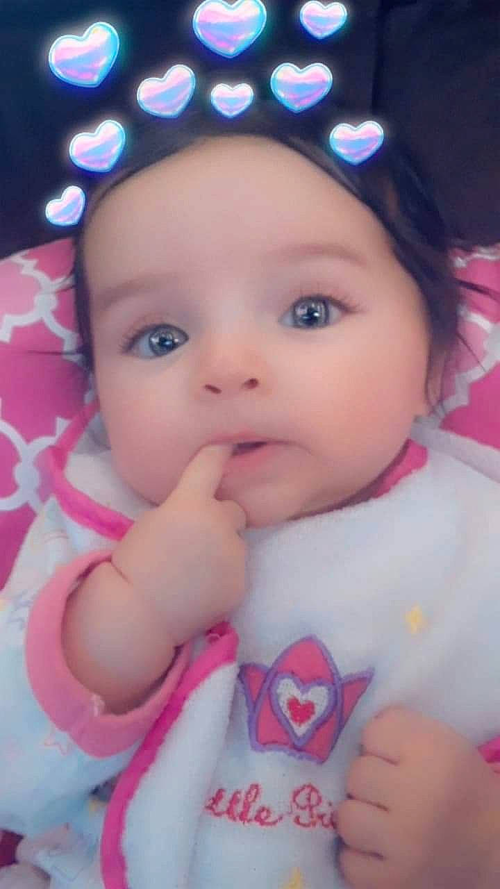 Prim Rose is registered to the contest to win money with this photo: baby, beauty, brown_hair, cheek, child, eye, eyebrow, face, finger, forehead, hair_accessory, head, iris, lip, mouth, nose, person, pink, skin, smile