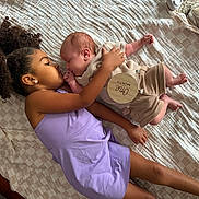 Gervonta joined the competition — help win amazing prizes! child, baby, toddler, cuddling, blanket, indoor, cute, love, family, newborn, purple_dress, curly_hair, sleeping_baby, wooden_tag, one_month, cozy, floor, sneaker, carpet, peaceful