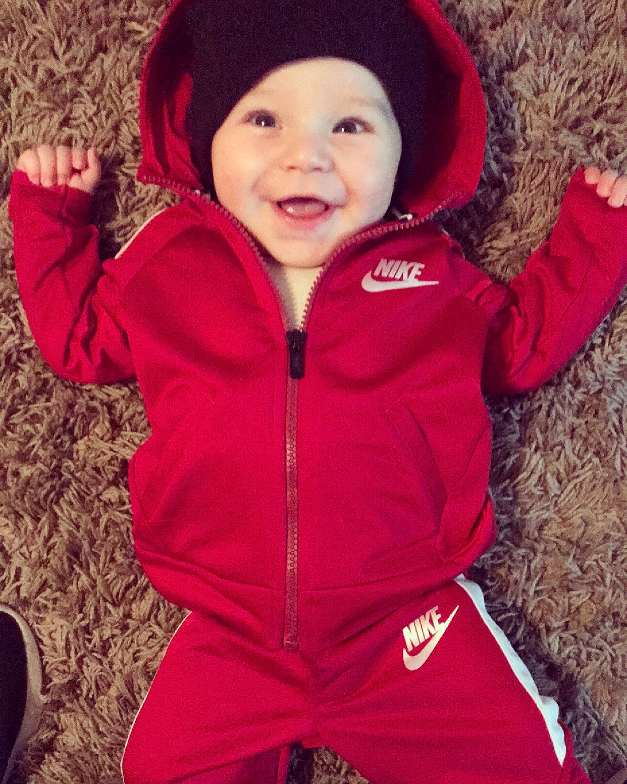 Canaan is registered to the contest to win money with this photo: child, clothing, cool, fur, happy, headgear, hood, hoodie, jacket, outerwear, person, pink, red, sleeve, smile, toddler, winter
