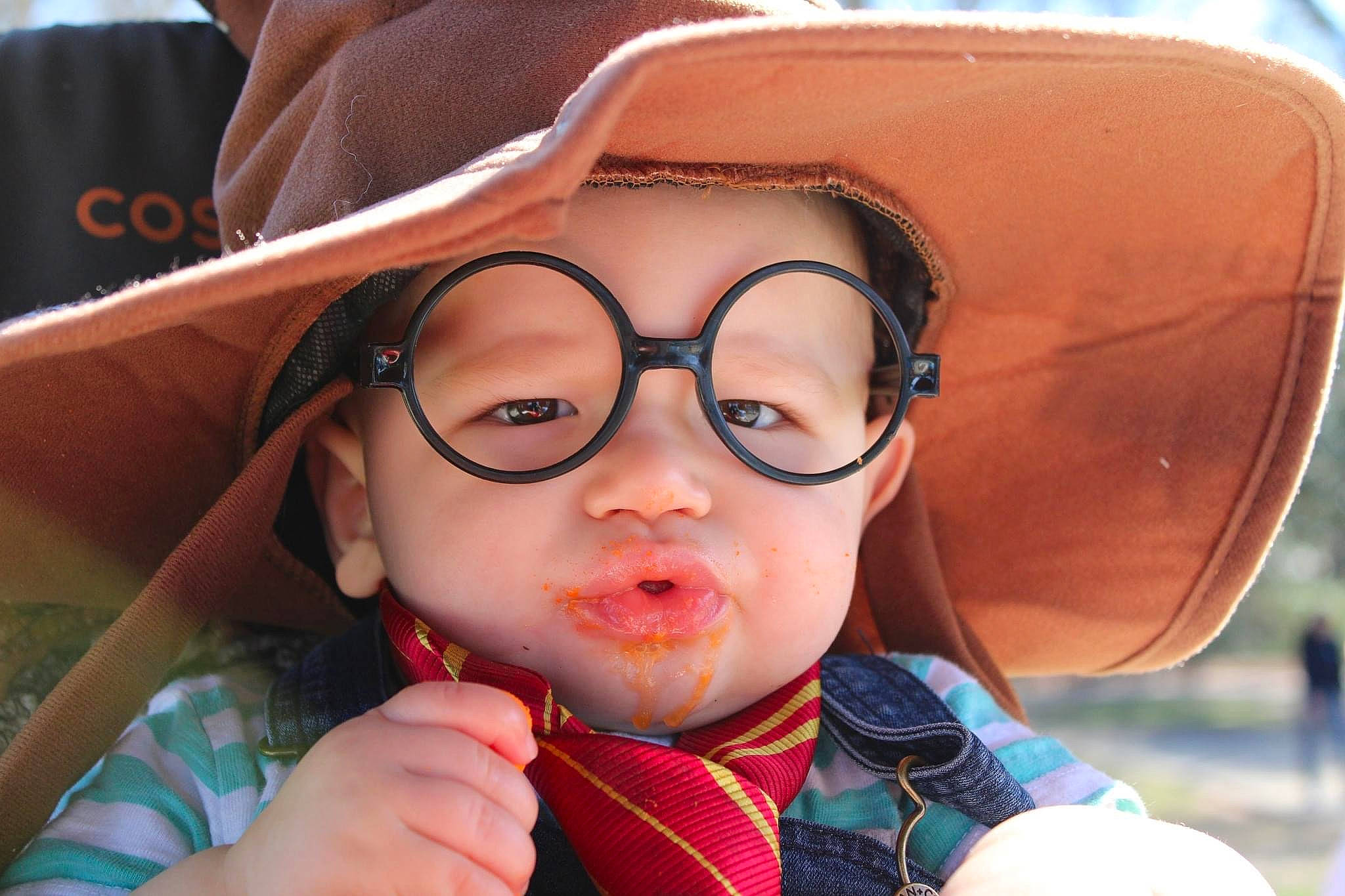 Keith is registered to the contest to win money with this photo: baby, cap, cheek, eyebrow, eyelash, eyewear, glasses, goggles, happy, hat, headwear, iris, lip, mouth, nose, person, personal_protective_equipment, skin, summer, sun_hat