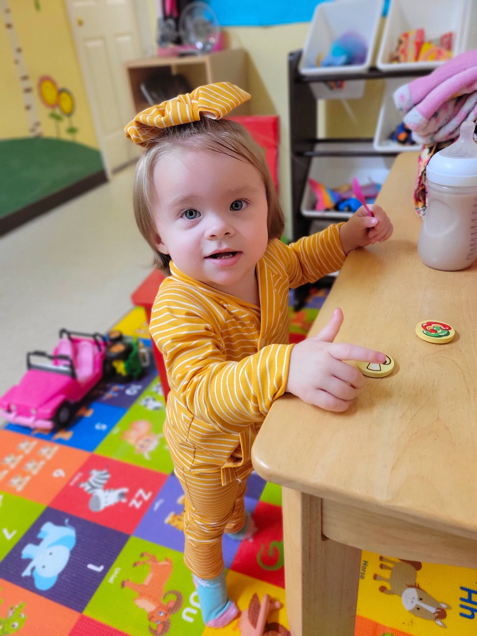 Aubriella joined the competition — help win amazing prizes! baby, baby_toddler_clothing, chair, child, desk, event, flooring, fun, happy, kindergarten, leisure, person, play, room, sharing, smile, table, tableware, toddler, wood