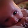 Keira Marie is registered to the contest to win money with this photo: baby, child, closeup, comfort, cute, expression, face, hand, indoors, infant, lying_down, person, portrait, relaxed, skin, sleepy, soft_light, thumb, toddler, young