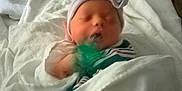 Keira Marie joined the competition — help win amazing prizes! baby, bed, blanket, bow, child, cute, hat, hospital, indoors, infant, newborn, peaceful, person, resting, sleeping, small, soft, striped, tender, wrapped