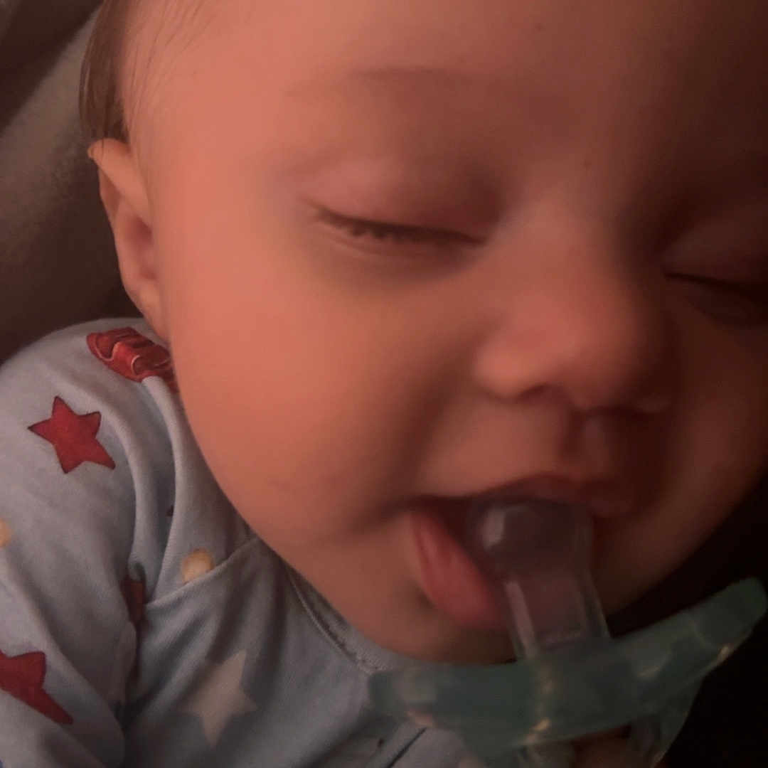 Kaysin is registered to the contest to win money with this photo: baby, blanket, child, closeup, cozy, cute, face, hand, indoors, infant, pacifier, pajamas, peaceful, person, portrait, relaxing, sleeping, soft, stars, young