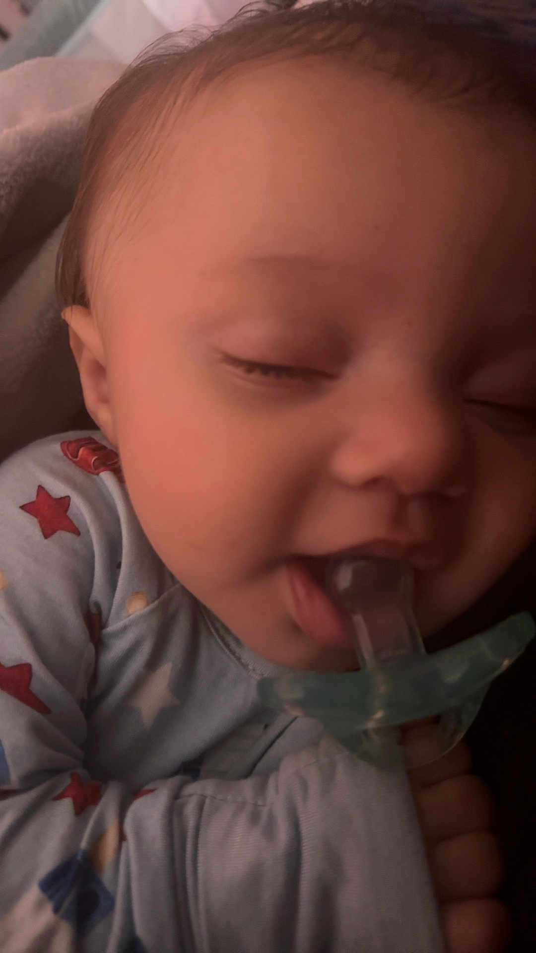 Kaysin is registered to the contest to win money with this photo: baby, pacifier, sleeping, pajamas, stars, closeup, face, infant, child, blanket, cozy, peaceful, cute, hand, soft, relaxing, indoors, young, person, portrait