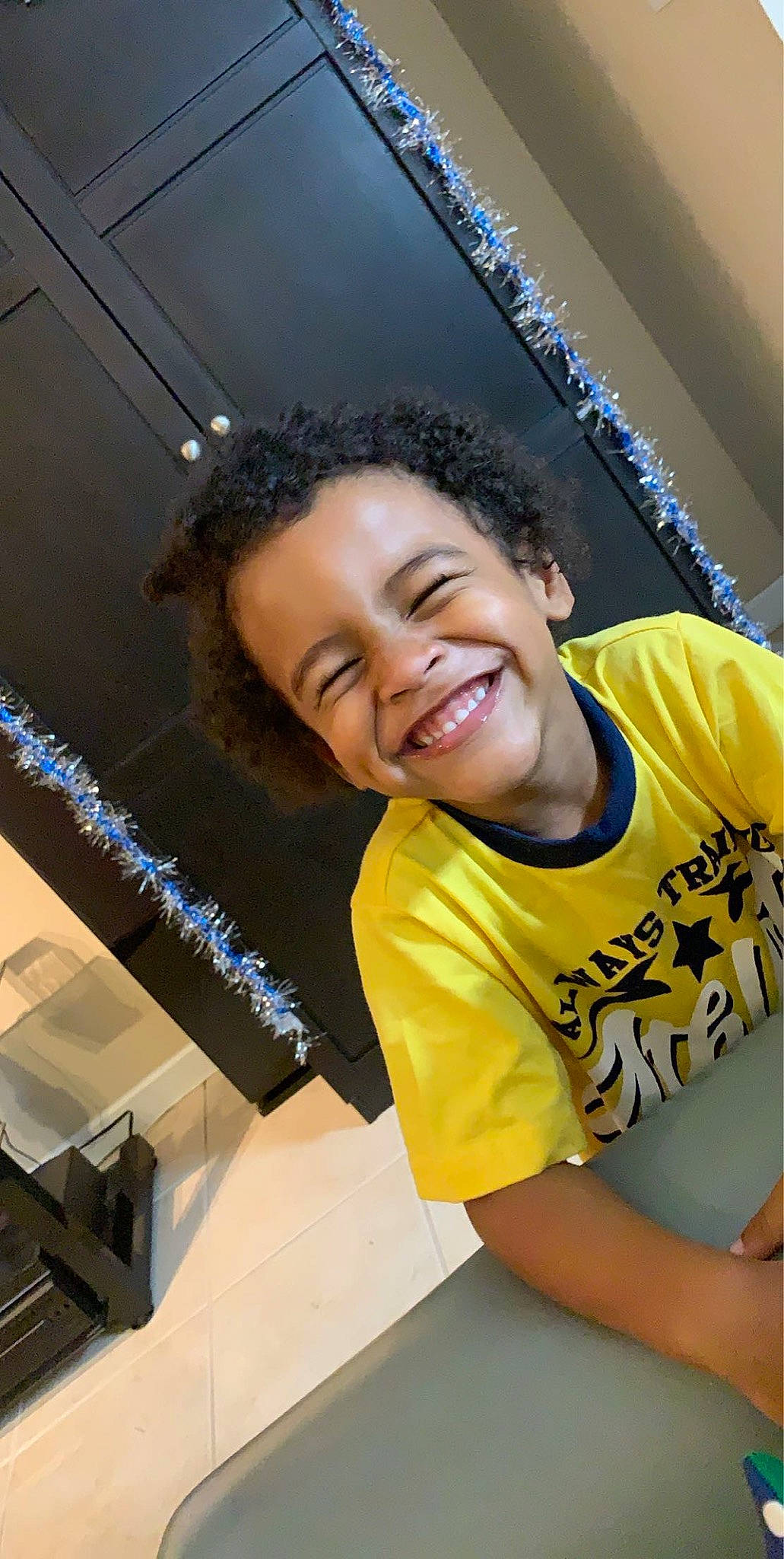 Mason is registered to the contest to win money with this photo: black_hair, fun, hair, hairstyle, joy, person, smile, yellow