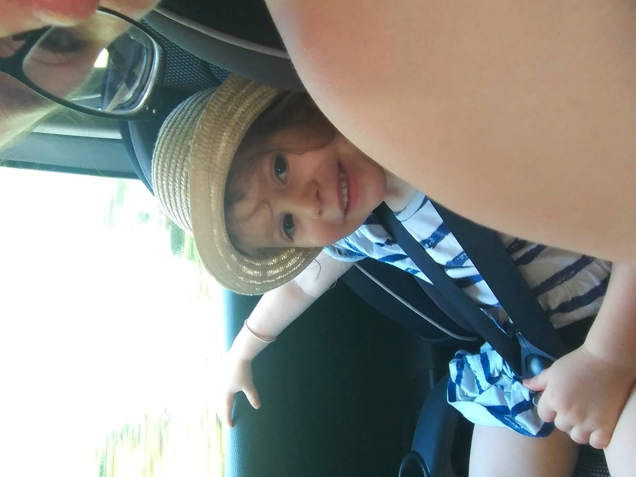 Aria-rose is registered to the contest to win money with this photo: auto_part, baby, child, cool, elbow, fashion_accessory, finger, fun, gesture, happy, hat, headwear, human_leg, joy, person, skin, smile, sun_hat, thigh, thumb