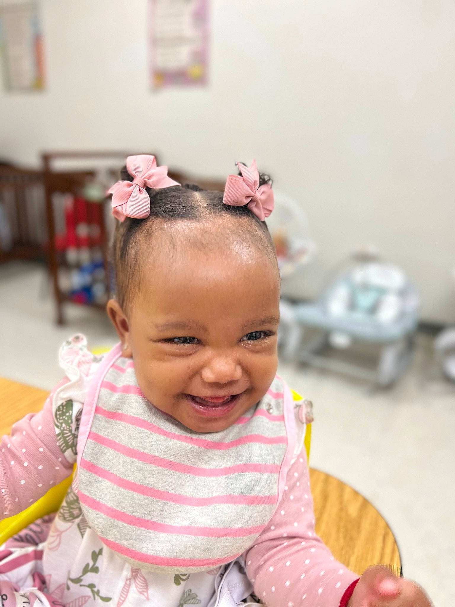 Maleah is registered to the contest to win money with this photo: baby, baby_toddler_clothing, chair, cheek, child, event, eyelash, fashion_accessory, flooring, fun, hair_accessory, happy, headpiece, joy, magenta, person, pink, room, sitting, skin