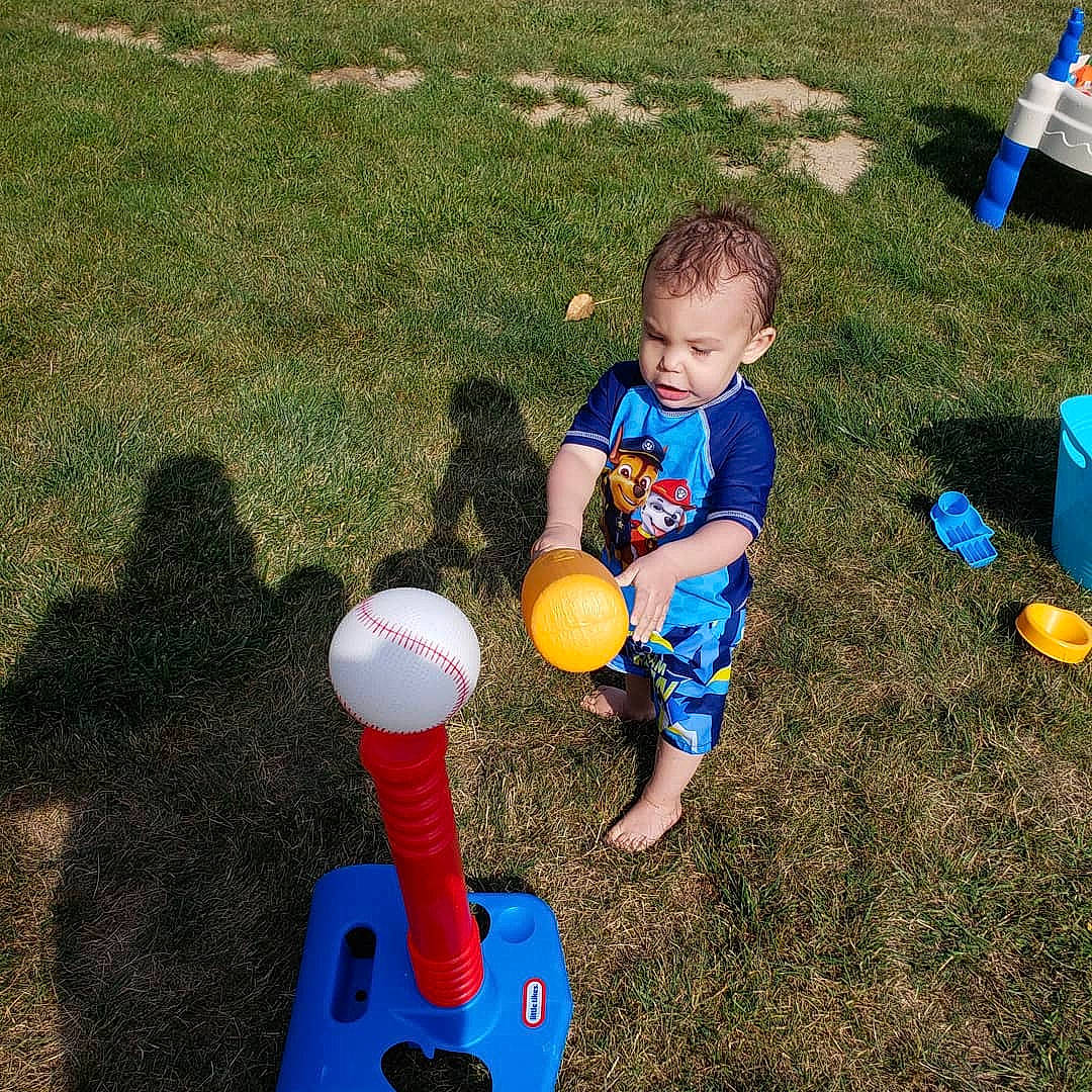 Ernest is registered to the contest to win money with this photo: backyard, child, fun, grass, lawn, outdoor_play_equipment, person, play, playground, public_space, recreation, toddler