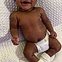 baby, smiling, diaper, blanket, knitted_booties, infant, cute, happy, lying_down, skin, child, one_person, indoors, soft_texture, face, newborn, toddler, human, comfort, sweet