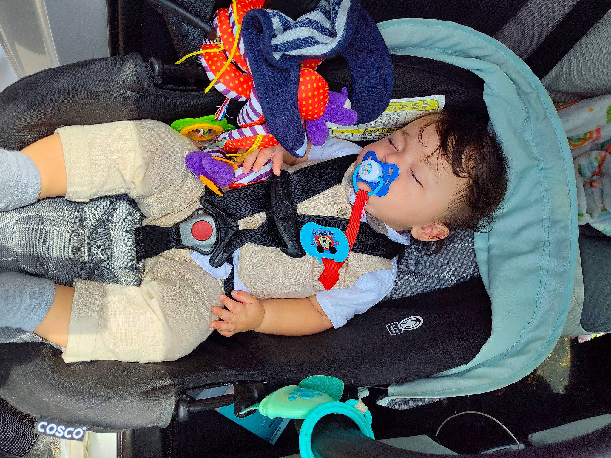 Josiah is registered to the contest to win money with this photo: auto_part, baby, baby_carriage, baby_products, bag, car_seat, child, comfort, costume, event, fictional_character, fun, human_leg, lap, mouth, person, sitting, thigh, toddler, vacation